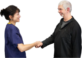 A woman in a nurses outfit shakes hands with a man.
