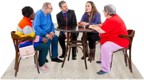 People sitting at a small round table chatting