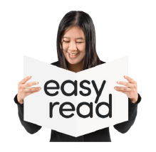 A lady holds up a book with the words Easy Read on it.