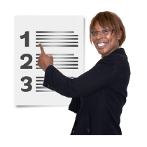 A black lady in a suit and glasses points at a sign that reads 1 2 3.