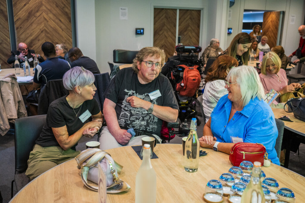 A group of people sitting at a table.