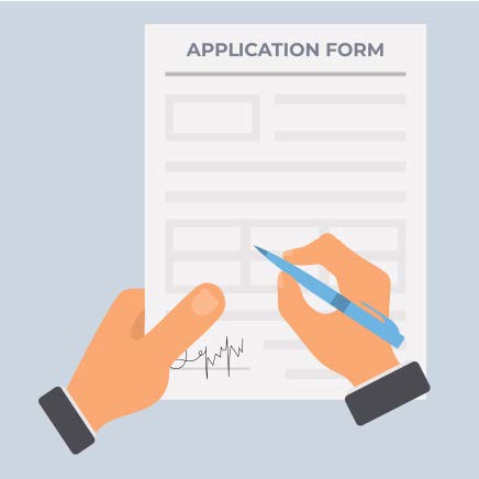 A hand holding a pen writing on an application form.