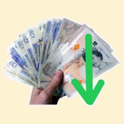 A hand holding cash money notes in a fan with a green arrow pointing down.