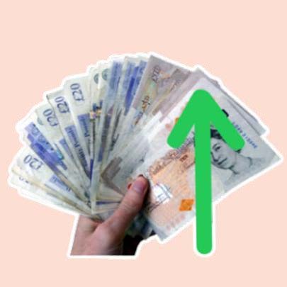 Hand holding cash notes with green up arrow