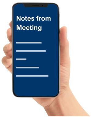 a hand holding a mobile phone showing notes from a meeting on the screen.