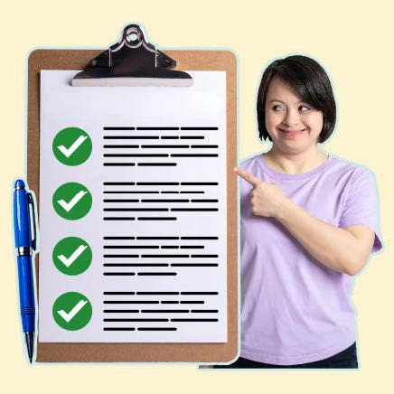 A smiling woman pointing to a list with ticks on it.
