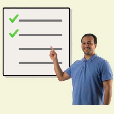 Man in a blue top pointing to list with green ticks on the first two items.