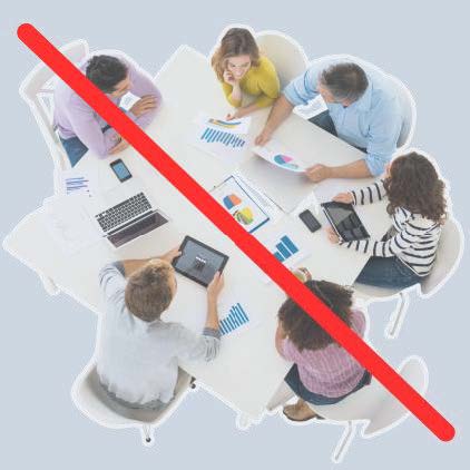 A group of people meeting at a table with a red line through the image.