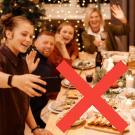 A Christmas lunch party with a red cross through it.