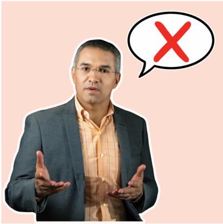 A man asking a question with a speech bubble with a big red cross x in it.