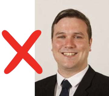 MSP Tom Arthur with a red cross beside him.
