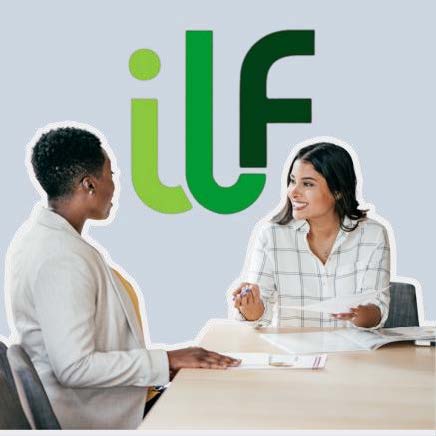 Two women talking at a table with ILF Logo overhead.