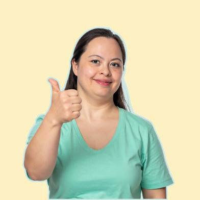 Woman in green giving a thumbs up.