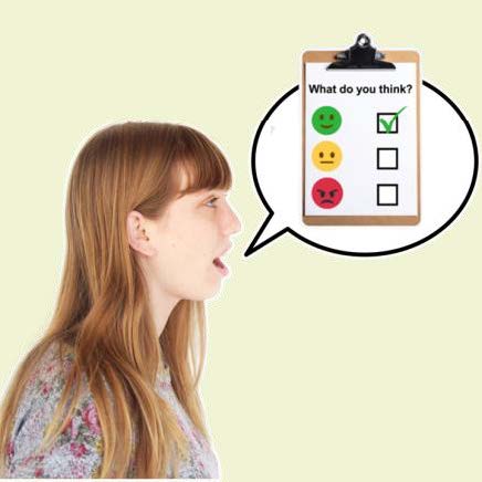 Ginger woman with a speech bubble. She's talking about a satisfaction survey with what do you think written on it and a tick on the green smiley face.
