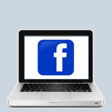 Laptop Computer with the blue F Facebook Logo on the screen.
