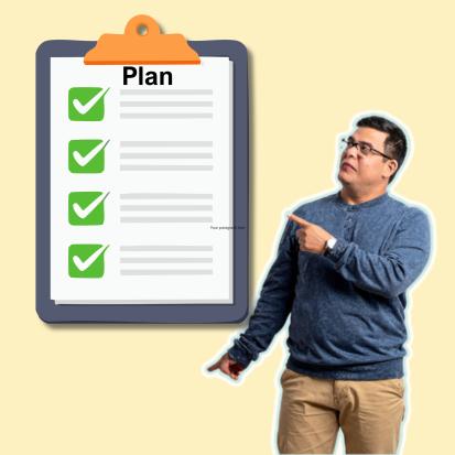 Man pointing to clipboard with plan written on it at the top.